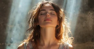 Woman sitting peacefully by a forest stream practicing mindfulness for gratitude journaling healing